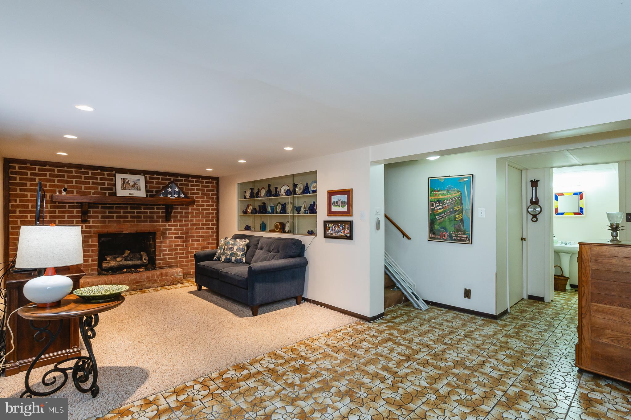 8337 Analee Avenue Rosedale, MD 21237 - Photo 33 of 48 a living room with furniture and a fireplace