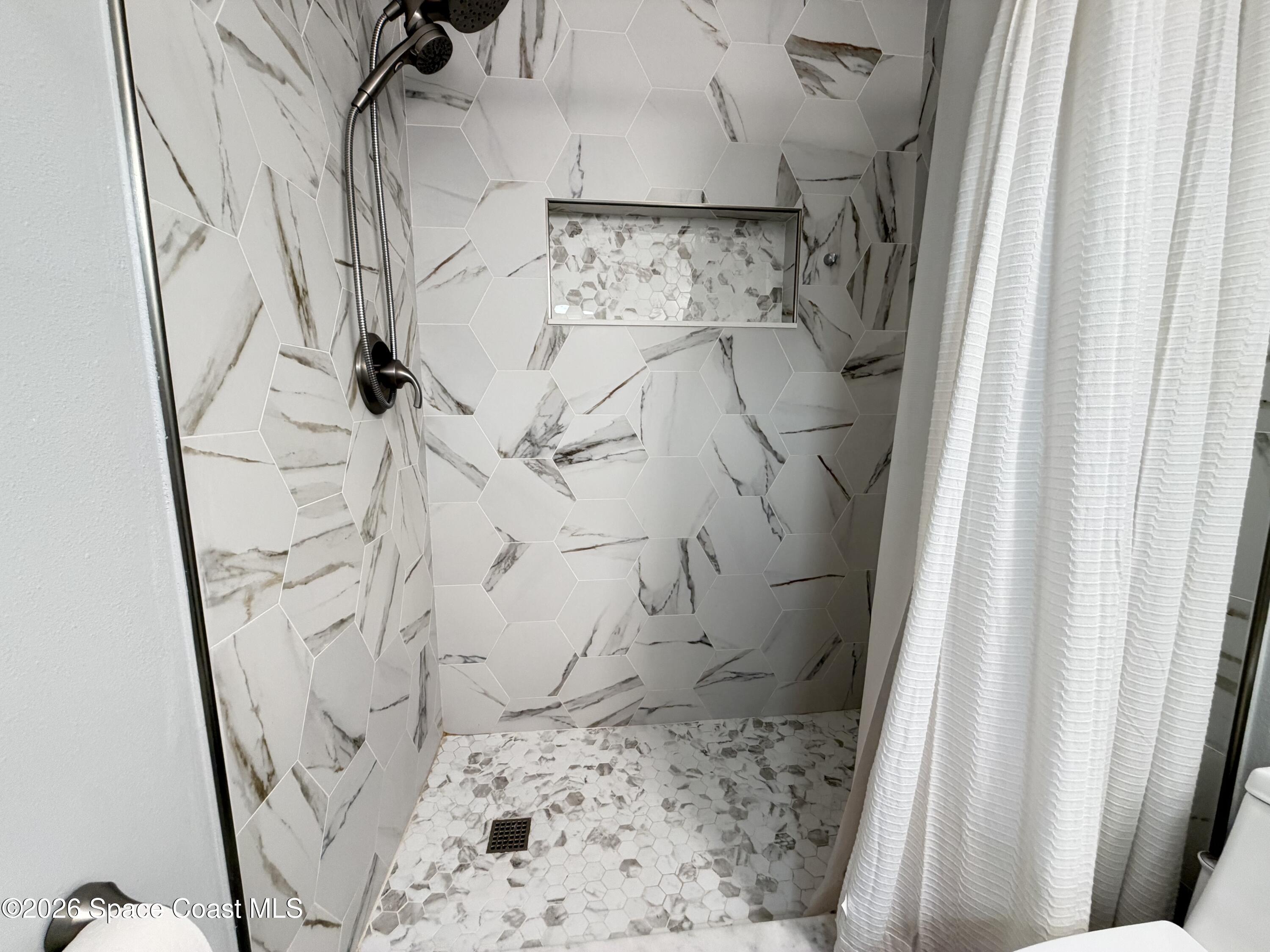 1578 West Powder Horn Road Titusville, FL 32796 - Photo 13 of 22 a bathroom with a shower
