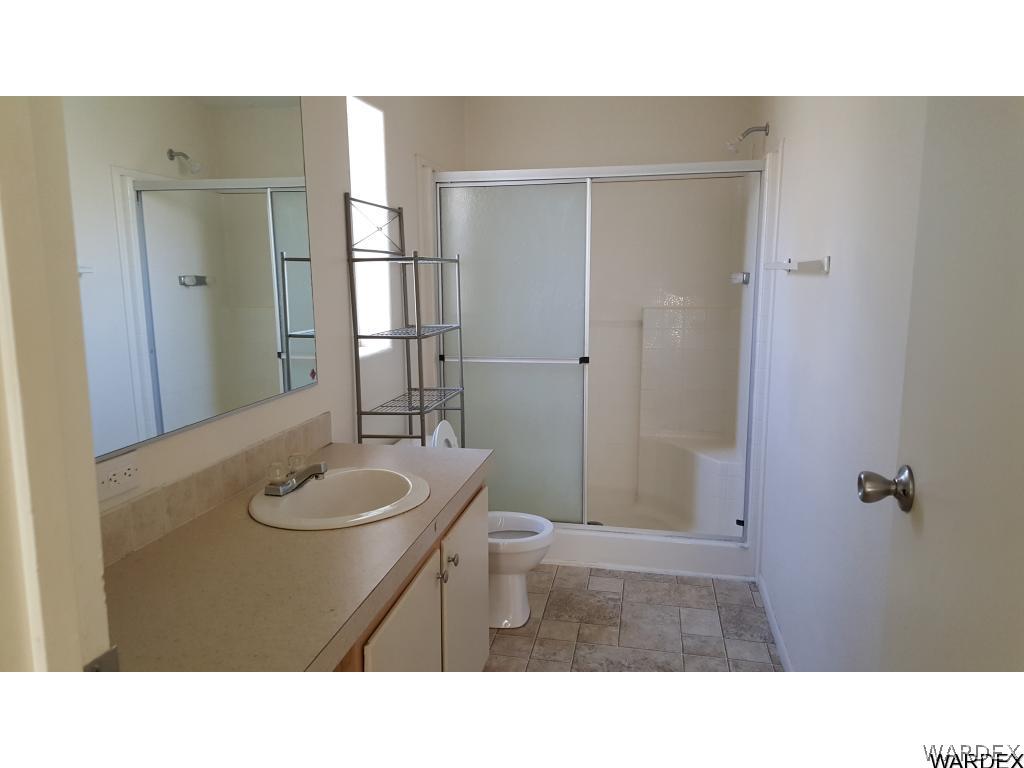 594 Paseo Del Rio Bullhead City, AZ 86442 - Photo 3 of 6 a bathroom with a sink a toilet and shower