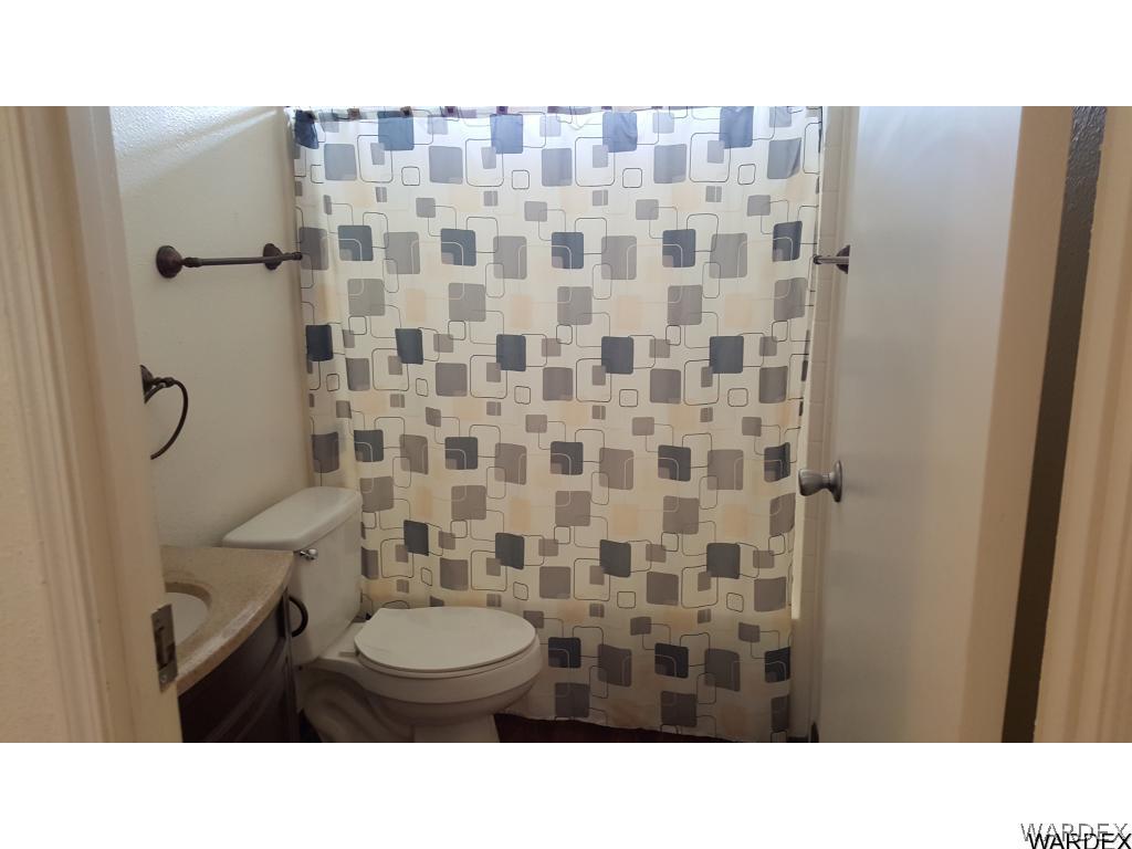 594 Paseo Del Rio Bullhead City, AZ 86442 - Photo 4 of 6 a bathroom with a toilet and a shower