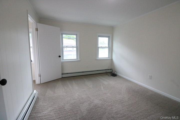 208 Center Street Ellenville, NY 12428 - Photo 6 of 13 an empty room with windows