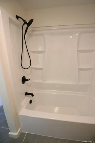 a bathroom with a shower and a bathtub
