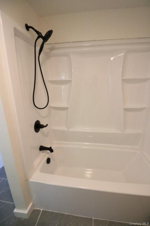 208 Center Street Ellenville, NY 12428 - Photo 9 of 13 a bathroom with a shower and a bathtub