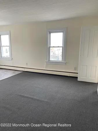 an empty room with a fireplace