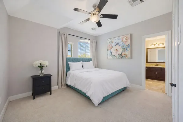 a view of a patio with table and chairs with wooden floor and fence