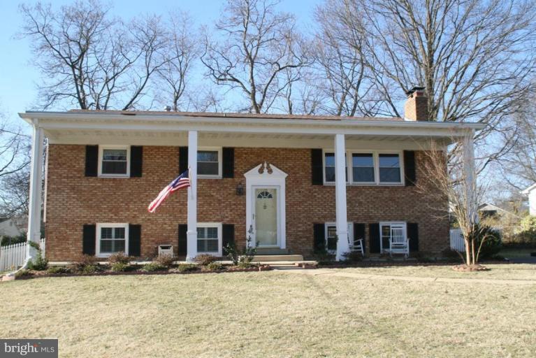 5705 Ashfield Road Alexandria, VA 22315 - Photo 1 of 28 a front view of a house with a yard