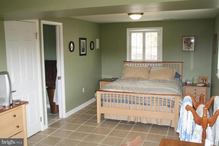 5705 Ashfield Road Alexandria, VA 22315 - Photo 12 of 28 a bedroom with a bed and a window