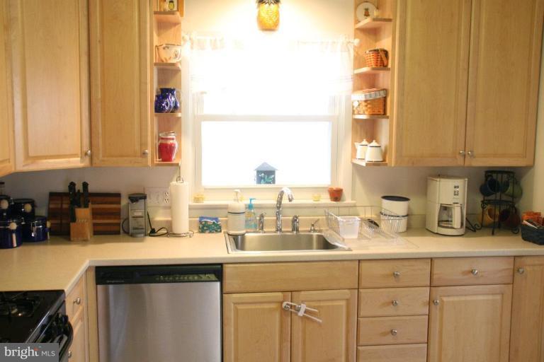 5705 Ashfield Road Alexandria, VA 22315 - Photo 3 of 28 a kitchen with sink a window and cabinets
