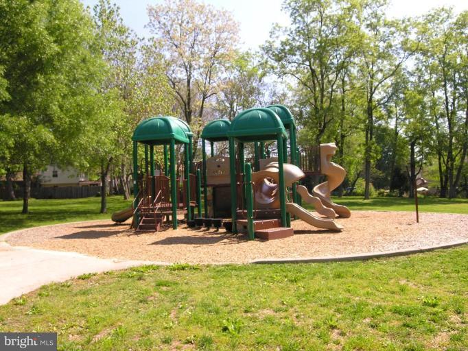 5705 Ashfield Road Alexandria, VA 22315 - Photo 25 of 28 a view of a park with swings and slides