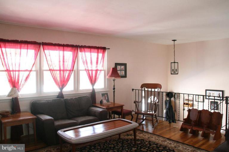 5705 Ashfield Road Alexandria, VA 22315 - Photo 6 of 28 a living room with furniture and a window