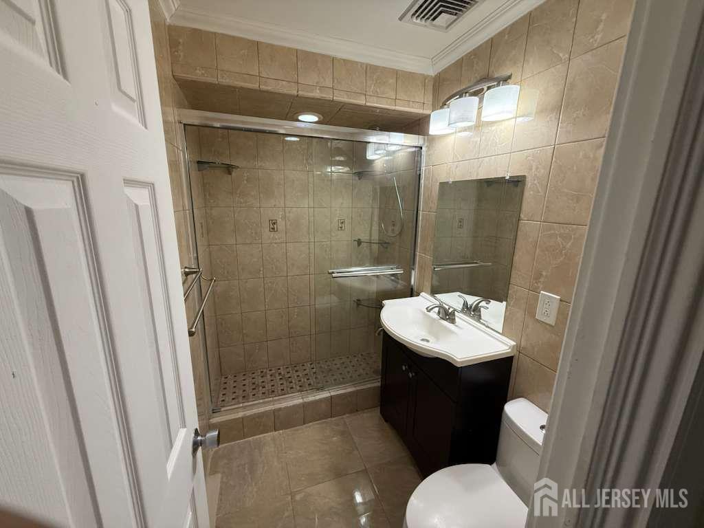 4 Rachel Terrace Piscataway, NJ 08854 - Photo 11 of 23 a bathroom with a sink toilet and shower