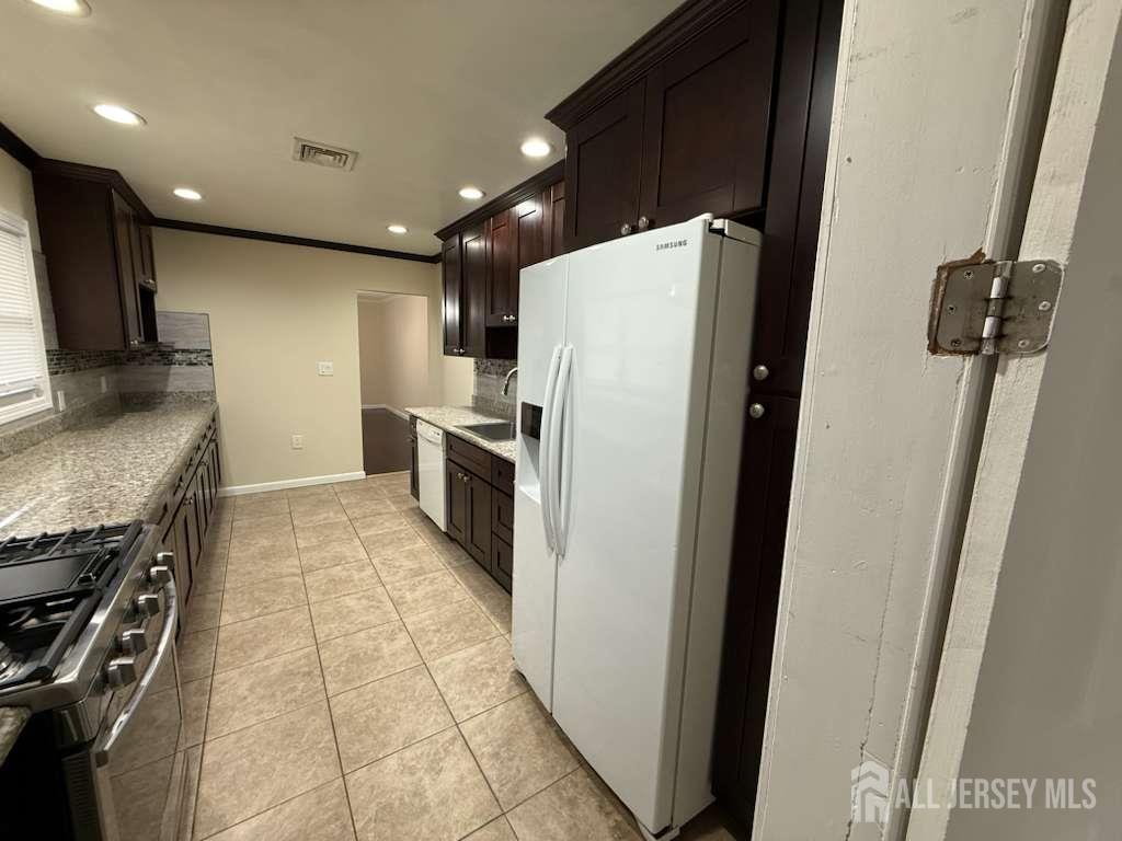 4 Rachel Terrace Piscataway, NJ 08854 - Photo 14 of 23 a kitchen with a refrigerator and a sink