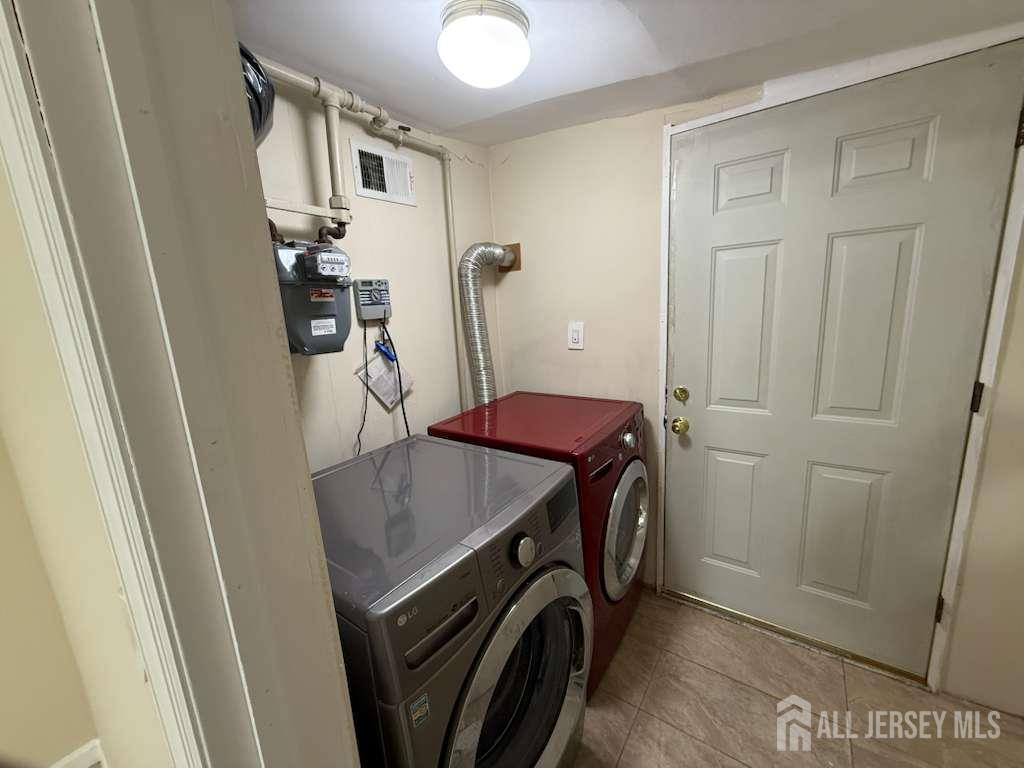 4 Rachel Terrace Piscataway, NJ 08854 - Photo 18 of 23 a utility room with dryer and washer