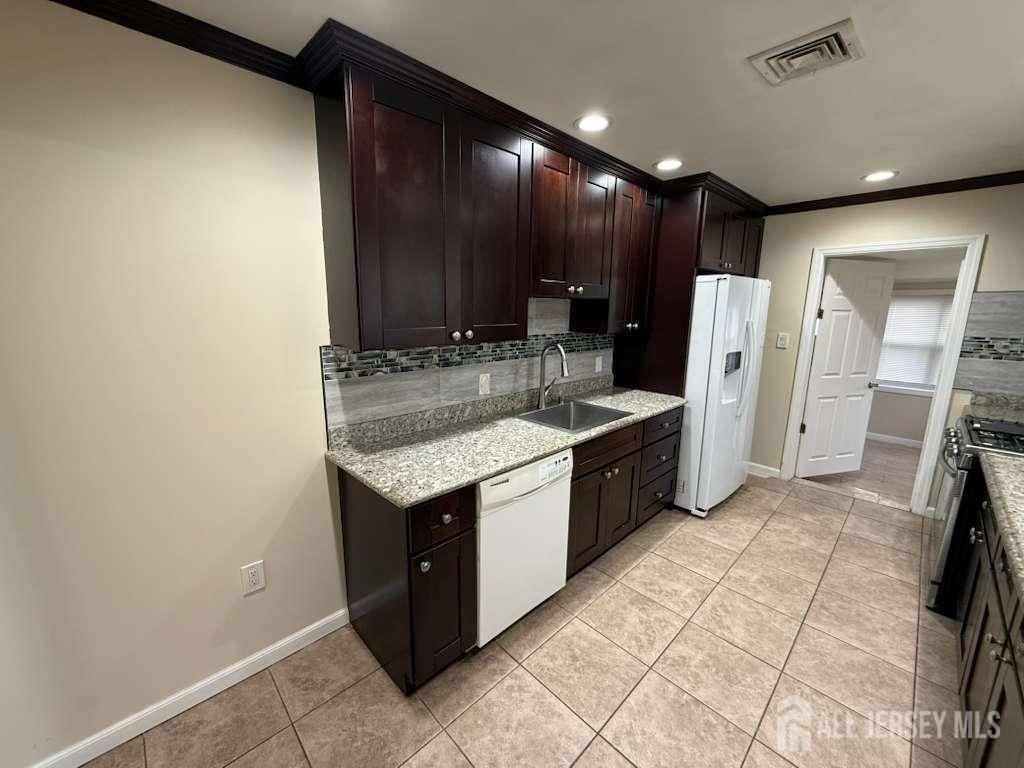 4 Rachel Terrace Piscataway, NJ 08854 - Photo 20 of 23 a kitchen with a sink cabinets and stainless steel appliances