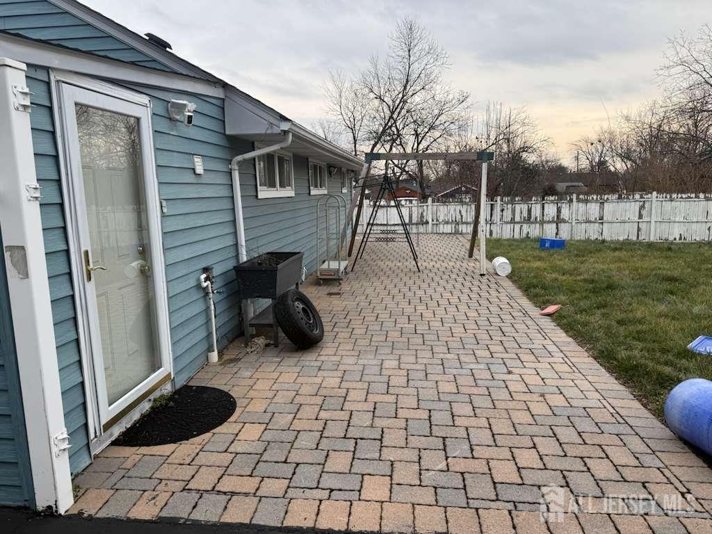 4 Rachel Terrace Piscataway, NJ 08854 - Photo 7 of 23 a view of a porch with a chairs and a rug