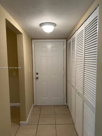 a kitchen with cabinets and appliances
