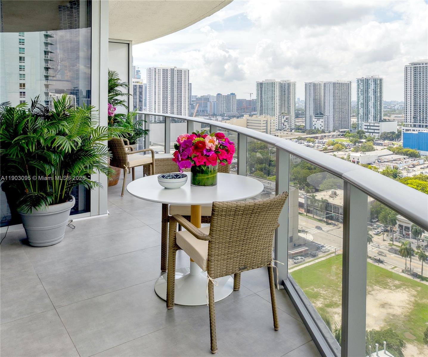 488 Northeast 18th Street, Unit 2301 Miami, FL 33132 - Photo 1 of 43 a view of terrace with seating space and potted plants