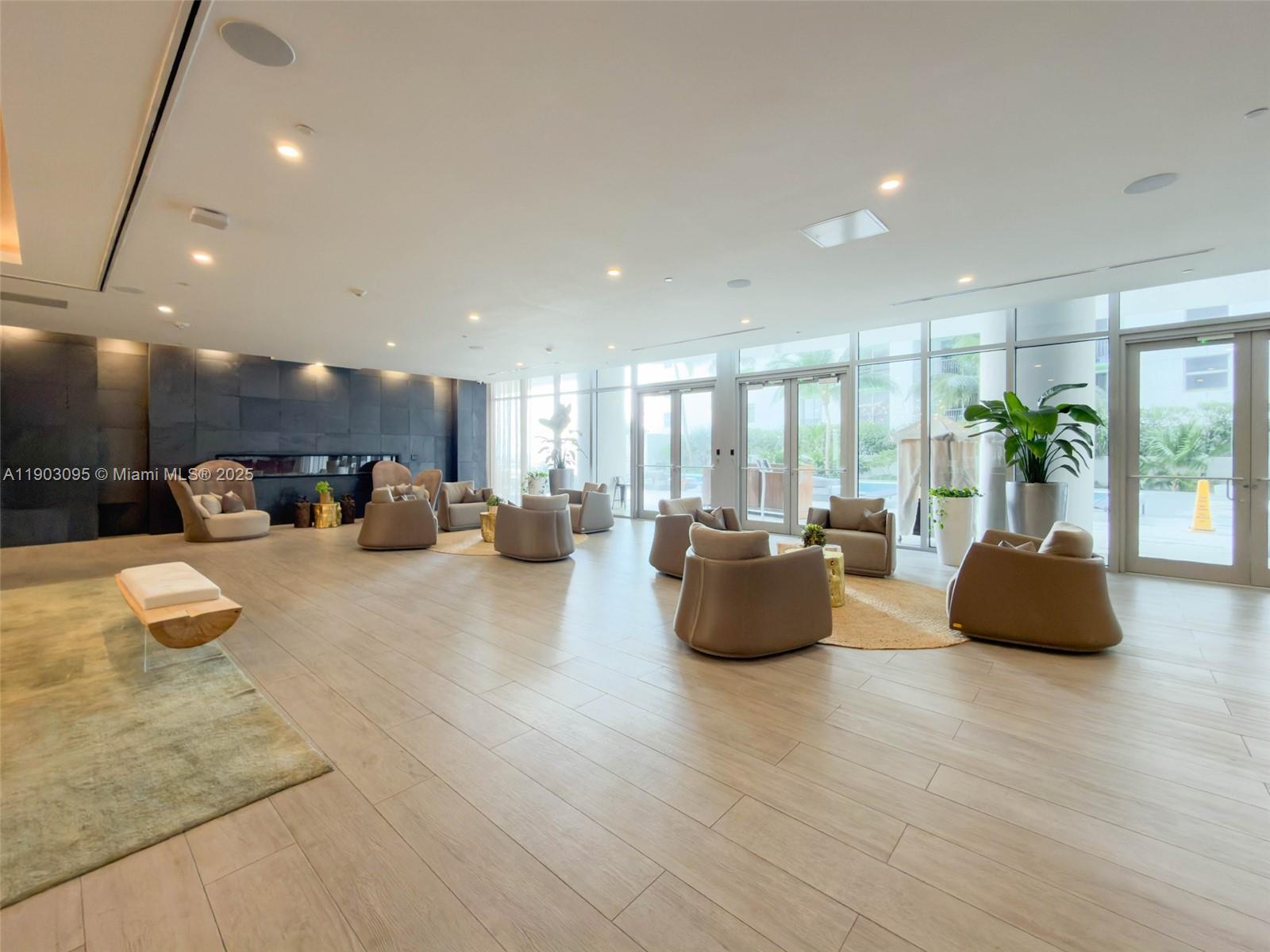 488 Northeast 18th Street, Unit 2301 Miami, FL 33132 - Photo 25 of 43 a living room with furniture and a large window