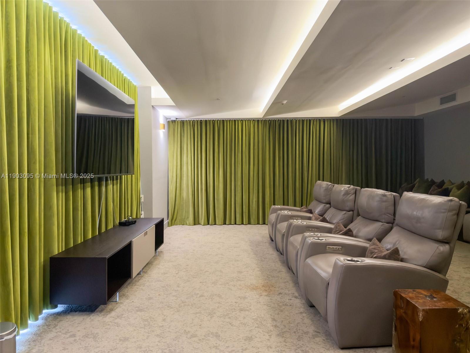 488 Northeast 18th Street, Unit 2301 Miami, FL 33132 - Photo 27 of 43 a balcony with furniture and a book shelf