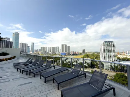 a view of a terrace with sitting area