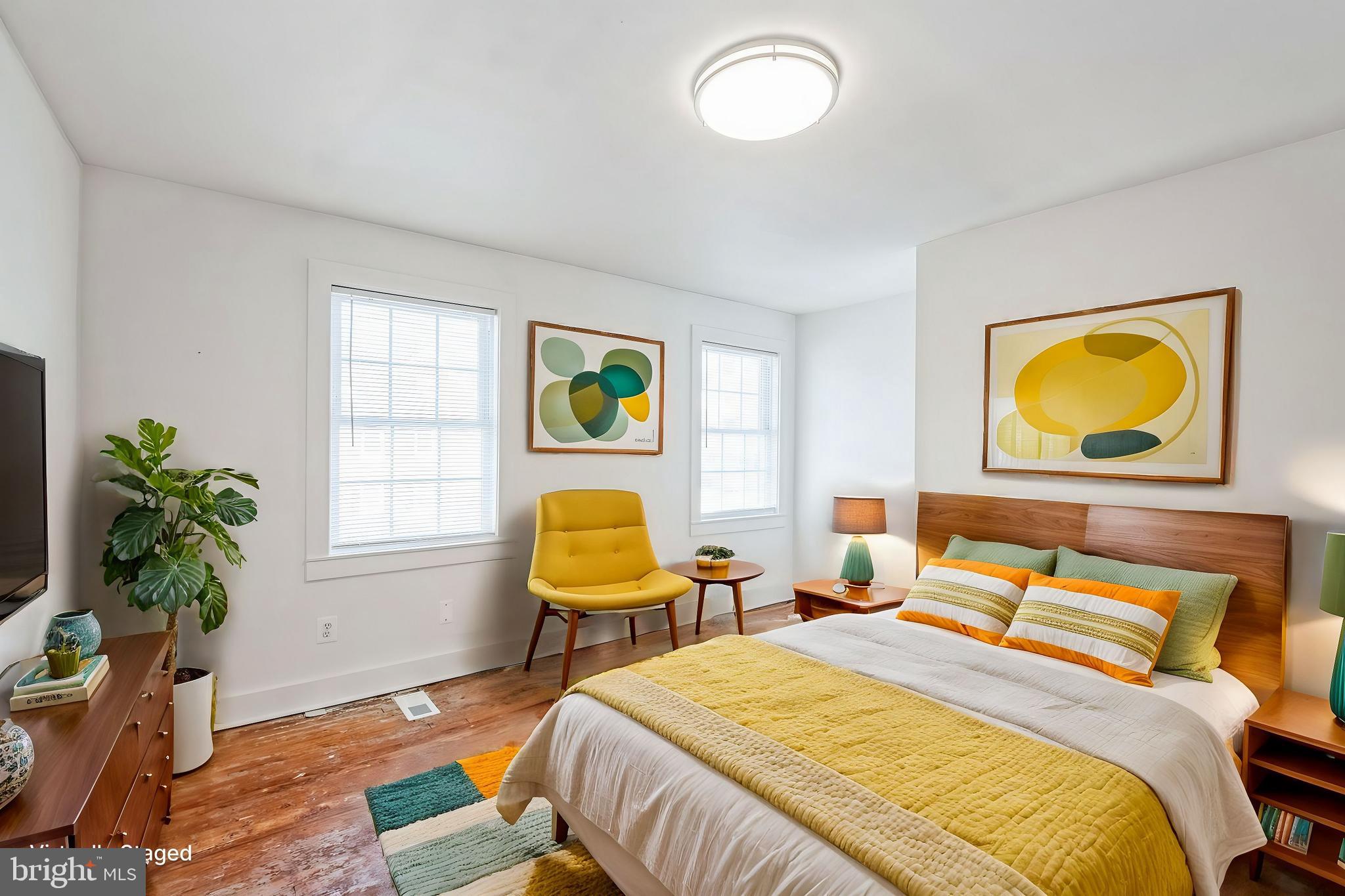 3805 V Street Southeast Washington, DC 20020 - Photo 25 of 31 a bedroom with 2 bed and a potted plant