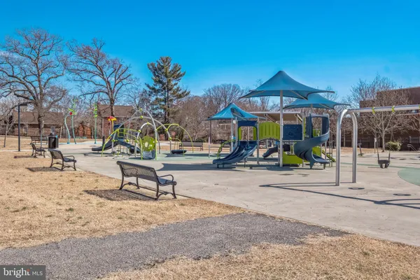 a view of a park with sitting area