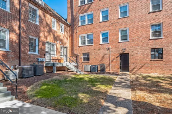 a view of a building with a yard