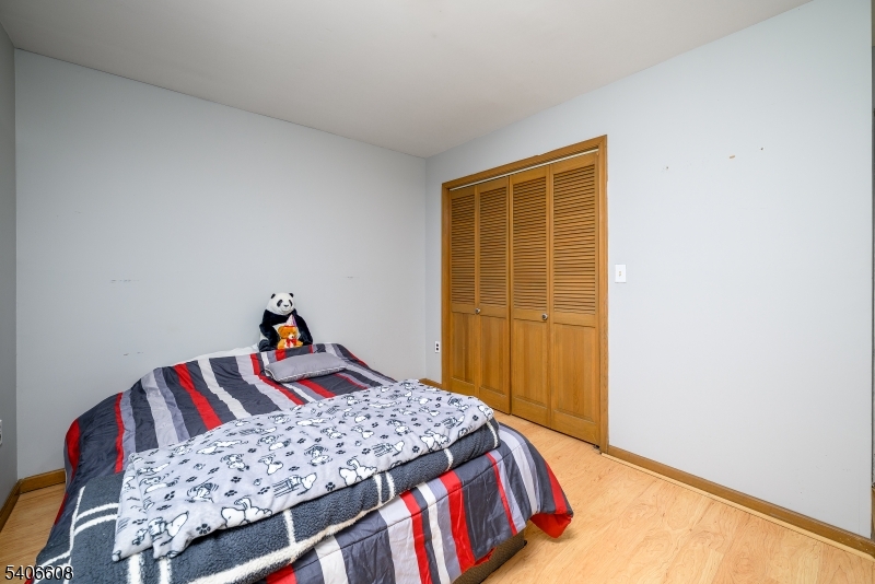 900 Valley Road, Unit D1O Clifton, NJ 07013 - Photo 11 of 16 a bedroom with a bed and a dresser