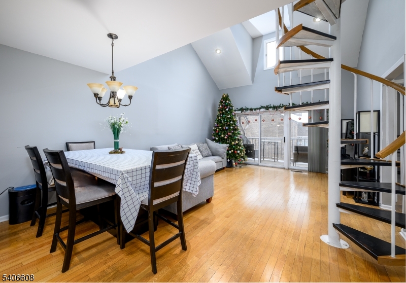 900 Valley Road, Unit D1O Clifton, NJ 07013 - Photo 4 of 16 a dining room with furniture and chandelier