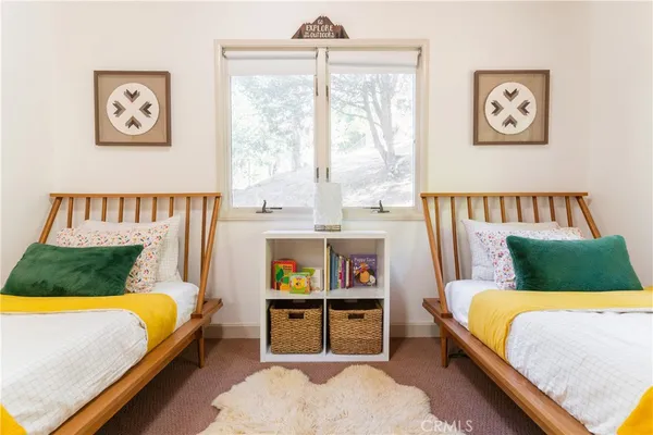 a bedroom with a bed and window