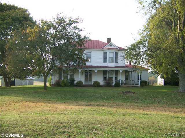 2329 Jonesboro Road Kenbridge, VA 23944 - Photo 1 of 12 a view of a big house with a big yard and large trees