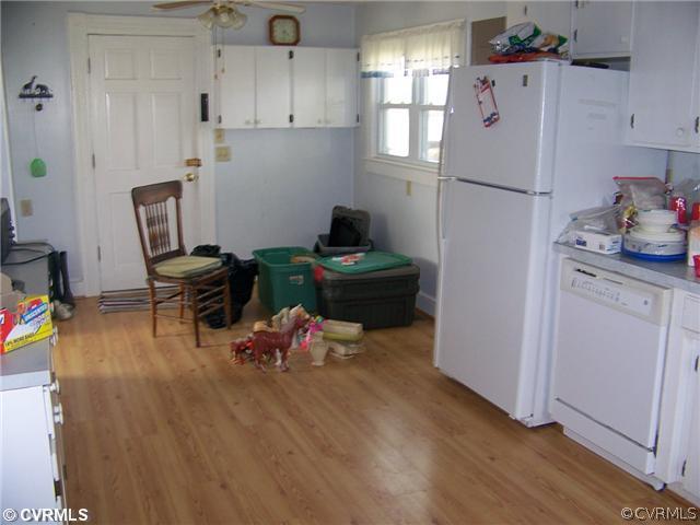 2329 Jonesboro Road Kenbridge, VA 23944 - Photo 8 of 12 a kitchen with a refrigerator and wooden floor