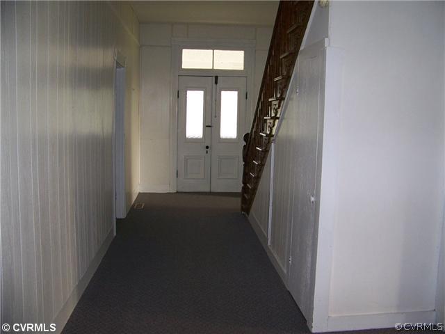 2329 Jonesboro Road Kenbridge, VA 23944 - Photo 9 of 12 a view of a hallway with a white walls and stairs
