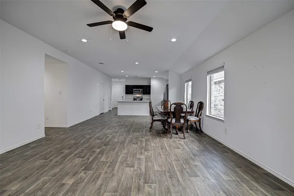 a view of a work space with furniture and a window