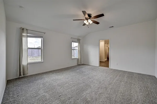 a view of empty room with windows