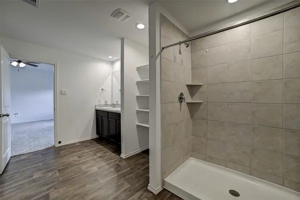 a bathroom with a bathtub and a shower