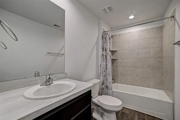 a bathroom with a sink toilet and a bathtub