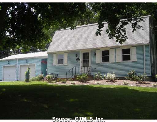 26 Yeomans Road Columbia, CT 06237 - Photo 1 of 1 a front view of a house with garden