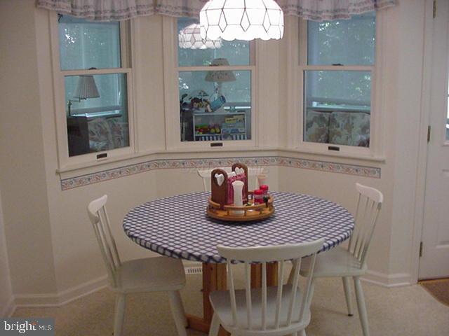 108 Sandyhook Road Ocean Pines, MD 21811 - Photo 14 of 19 a table and chairs in a balcony