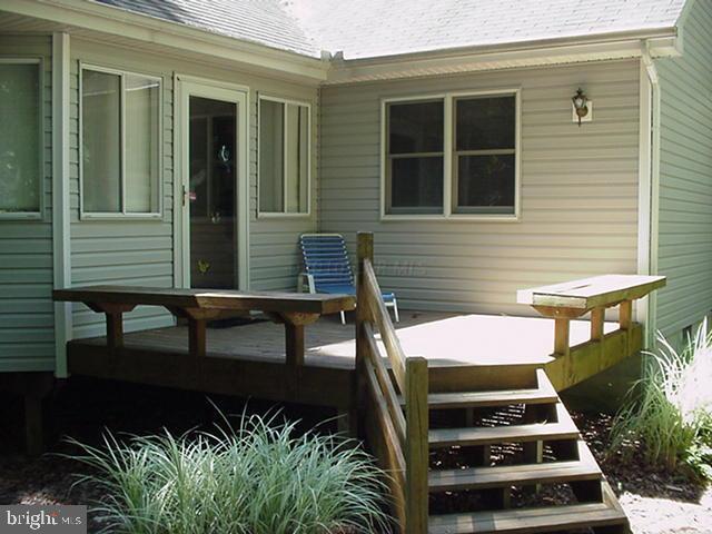 108 Sandyhook Road Ocean Pines, MD 21811 - Photo 8 of 19 a view of a patio with two chairs and a potted plant