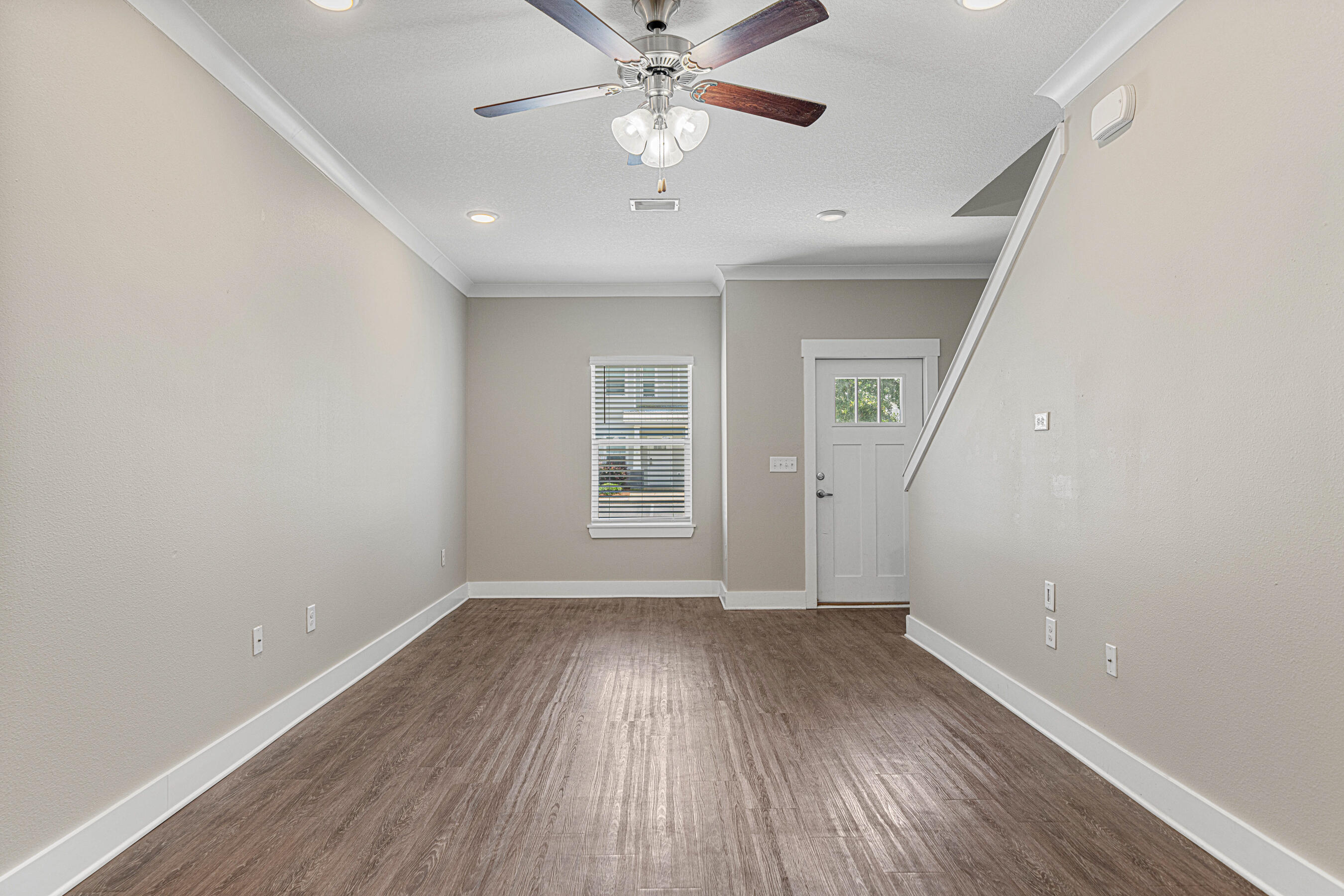 182 North Sand Palm Road Freeport, FL 32439 - Photo 11 of 38 wooden floor in an empty room with a window