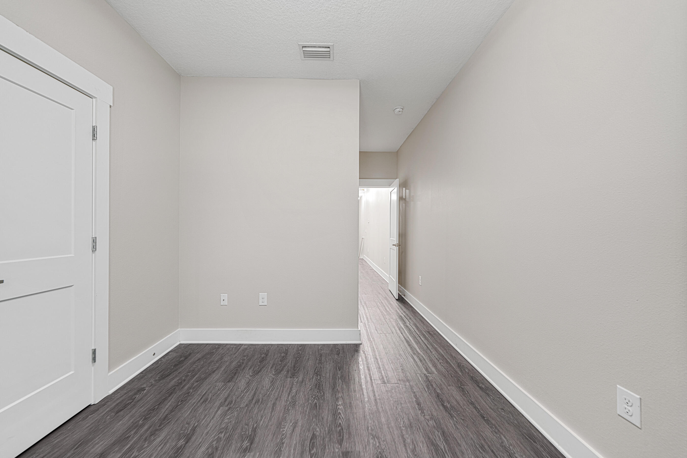 182 North Sand Palm Road Freeport, FL 32439 - Photo 17 of 38 a view of an empty room with wooden floor