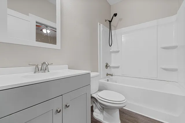 a bathroom with a sink a toilet and a bathtub