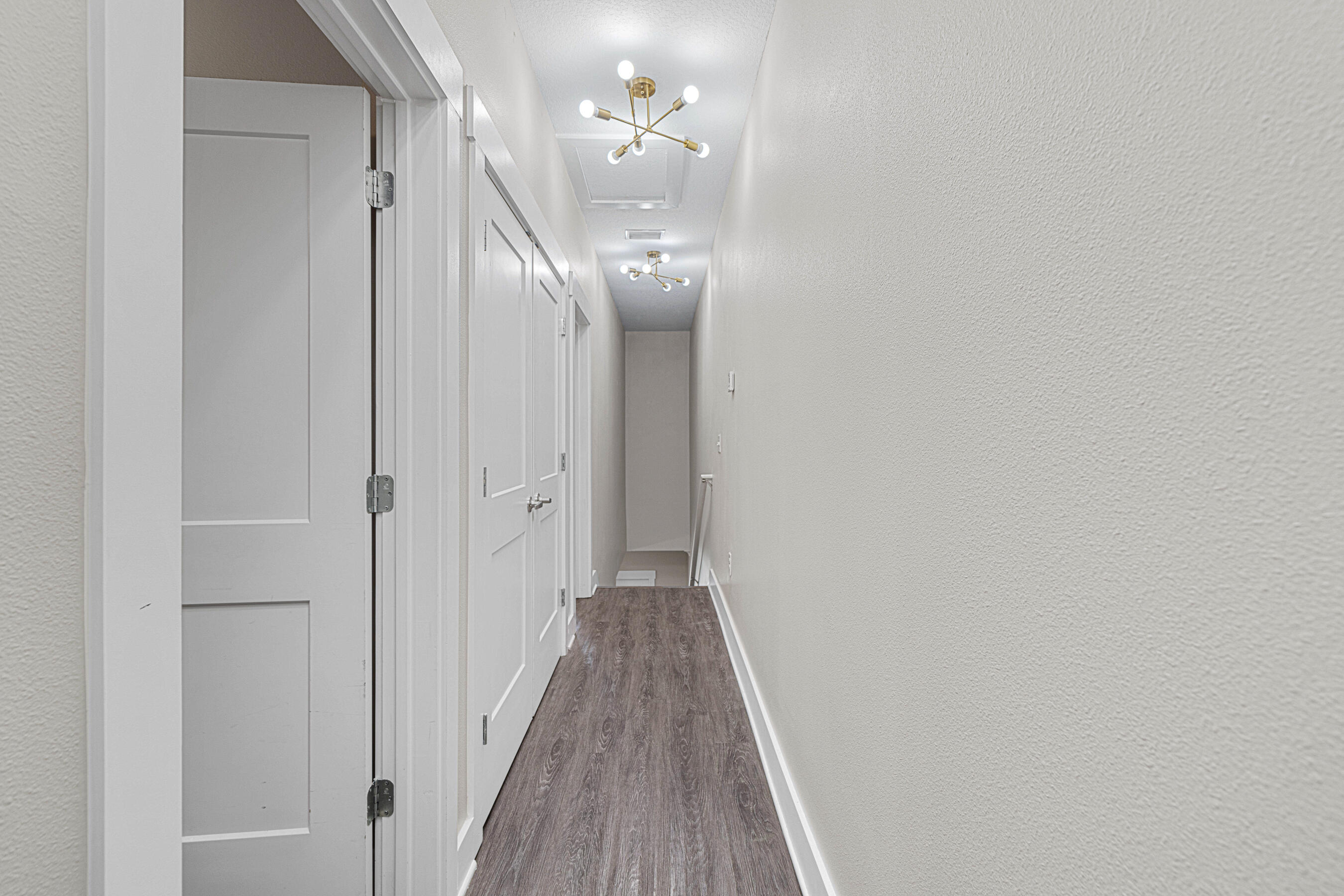 182 North Sand Palm Road Freeport, FL 32439 - Photo 27 of 38 a view of a hallway with wooden floor