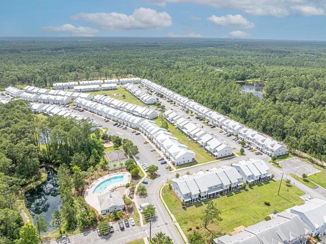 a view of a swimming pool with a yard