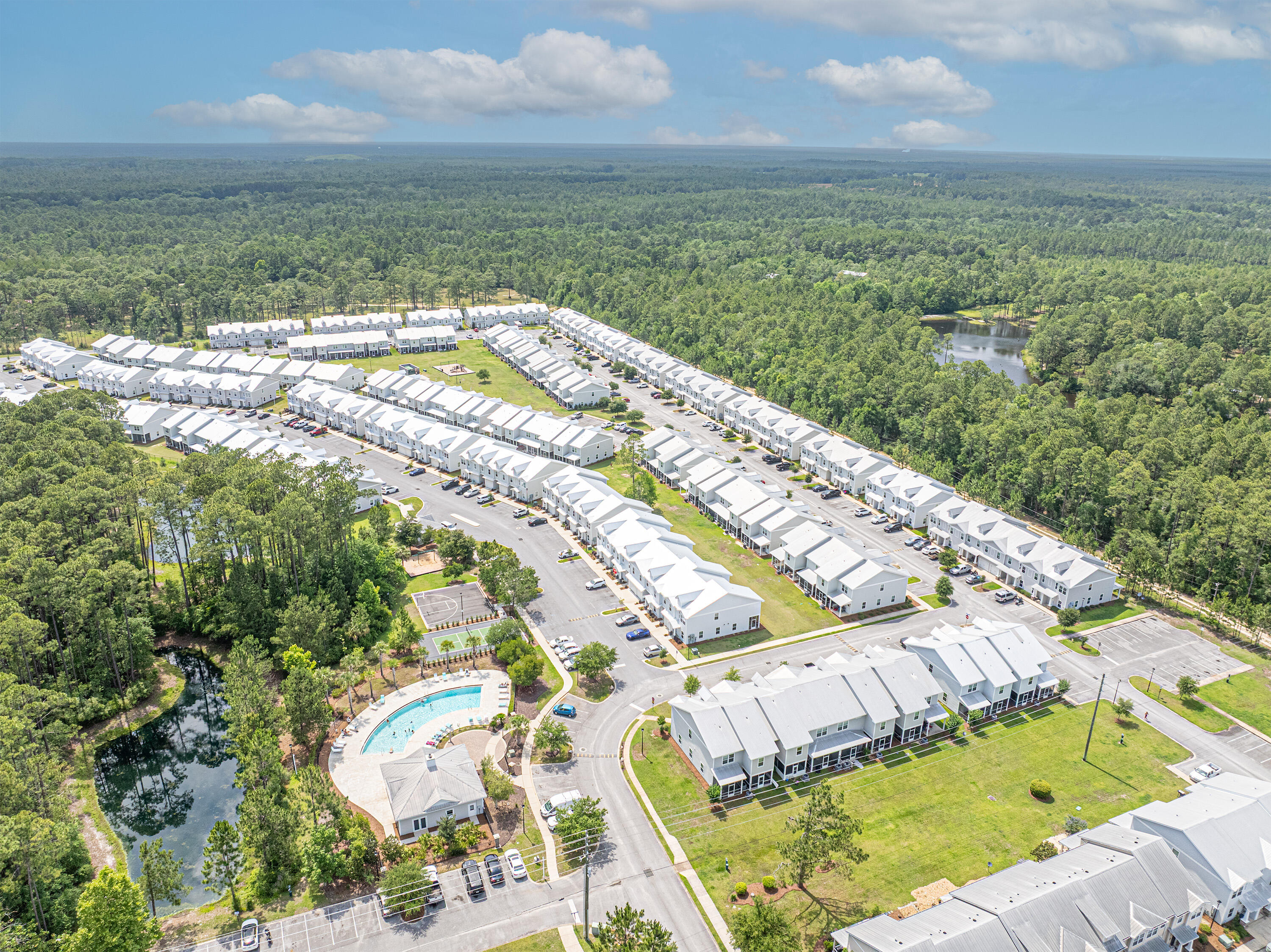 182 North Sand Palm Road Freeport, FL 32439 - Photo 31 of 38 a view of a swimming pool with a yard