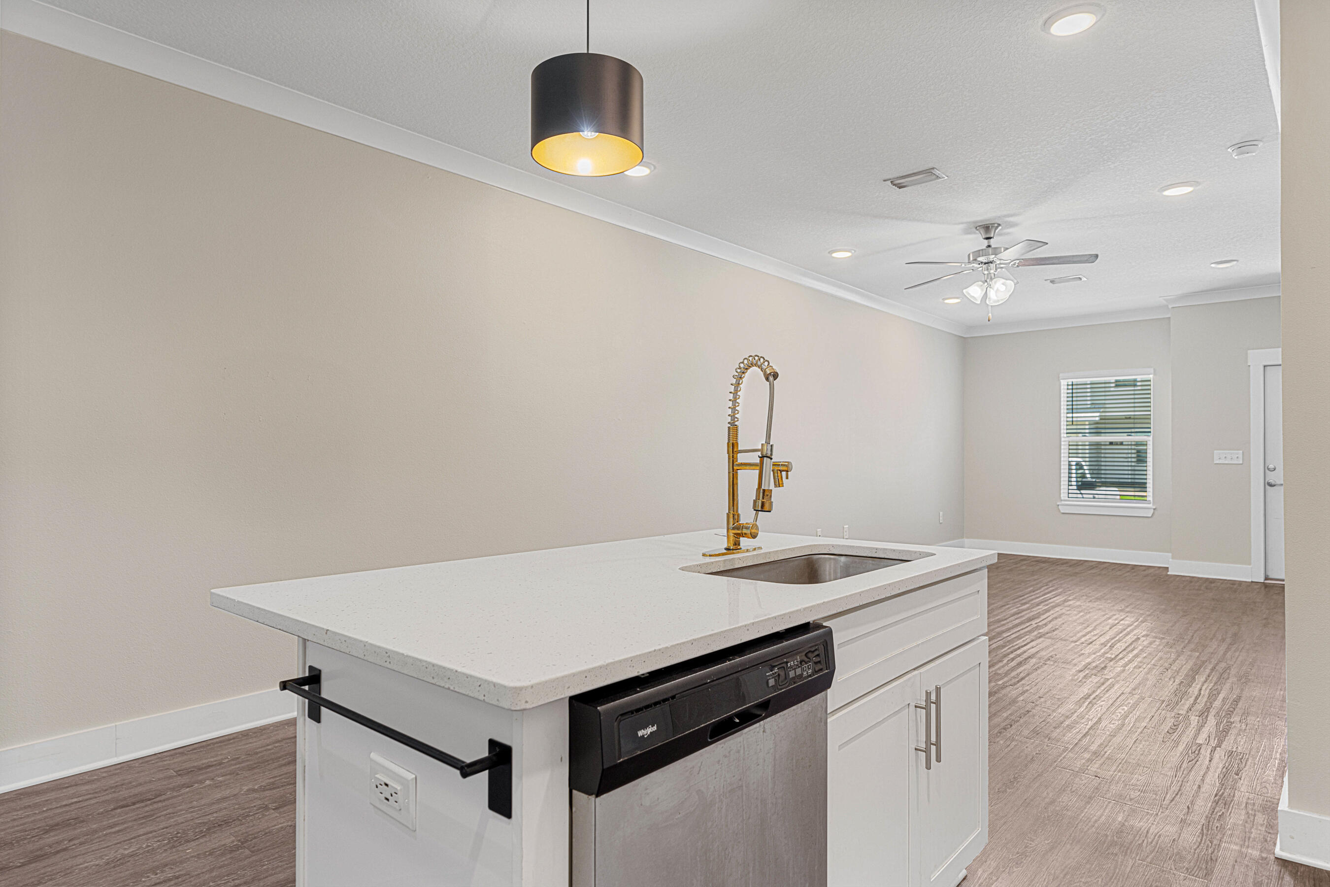 182 North Sand Palm Road Freeport, FL 32439 - Photo 9 of 38 a kitchen with a stove a sink and a wooden floor