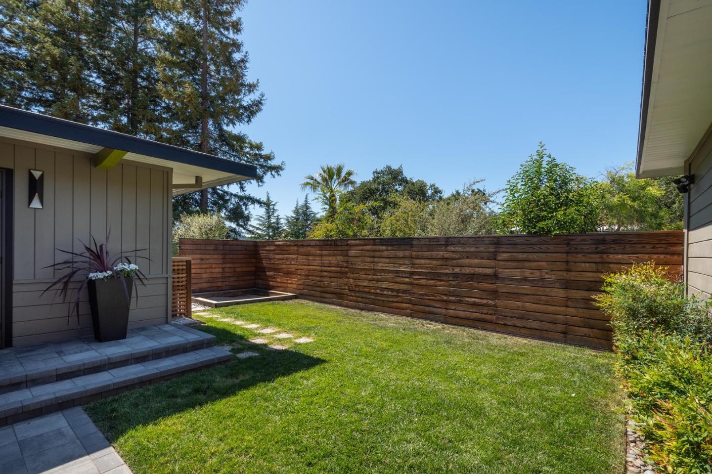 933 Janet Lane Lafayette, CA 94549 - Photo 19 of 30 a view of a backyard with wooden fence and a bench
