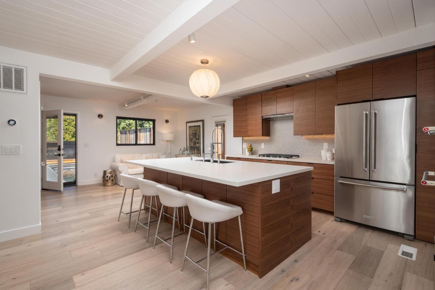 933 Janet Lane Lafayette, CA 94549 - Photo 6 of 30 a kitchen with kitchen island a counter top space a sink stainless steel appliances and cabinets