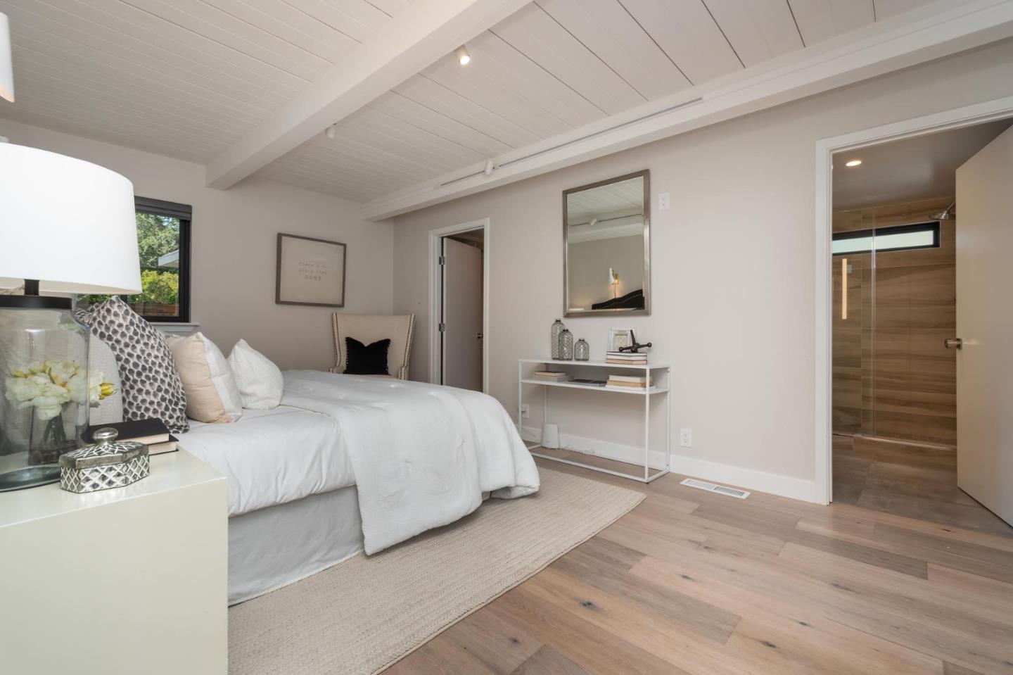 933 Janet Lane Lafayette, CA 94549 - Photo 9 of 30 a bedroom with a large bed and wooden floor